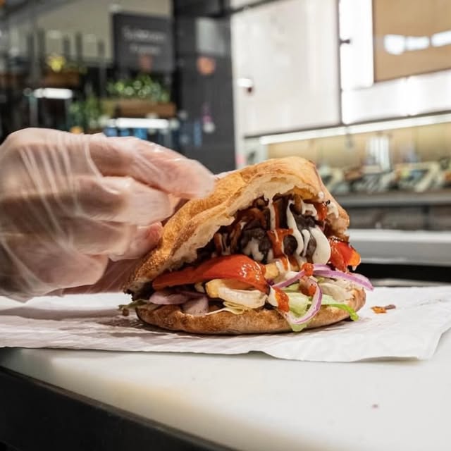 A döner sandwich being filled at Parsley Berliner Döner Kebab